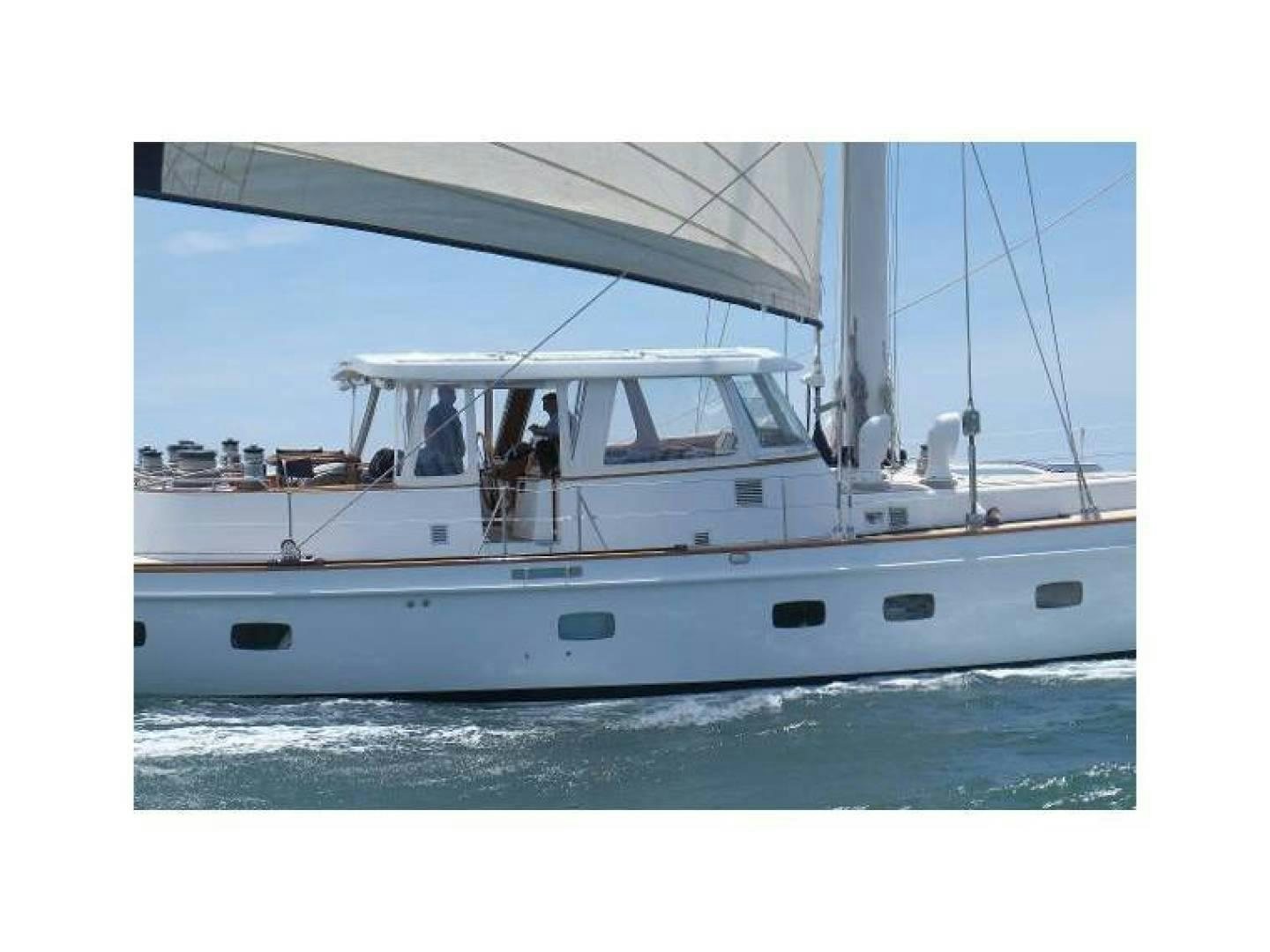 a white boat on the water aboard ARIA Yacht for Sale