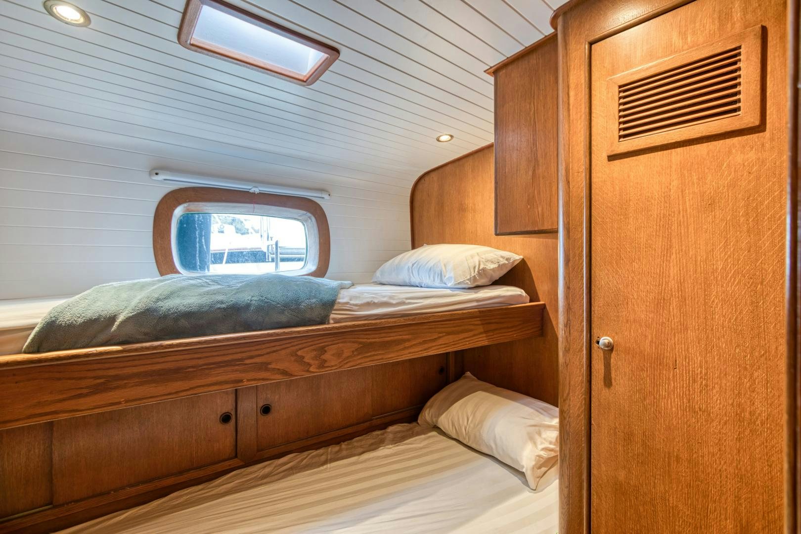 a room with two beds aboard ARIA Yacht for Sale