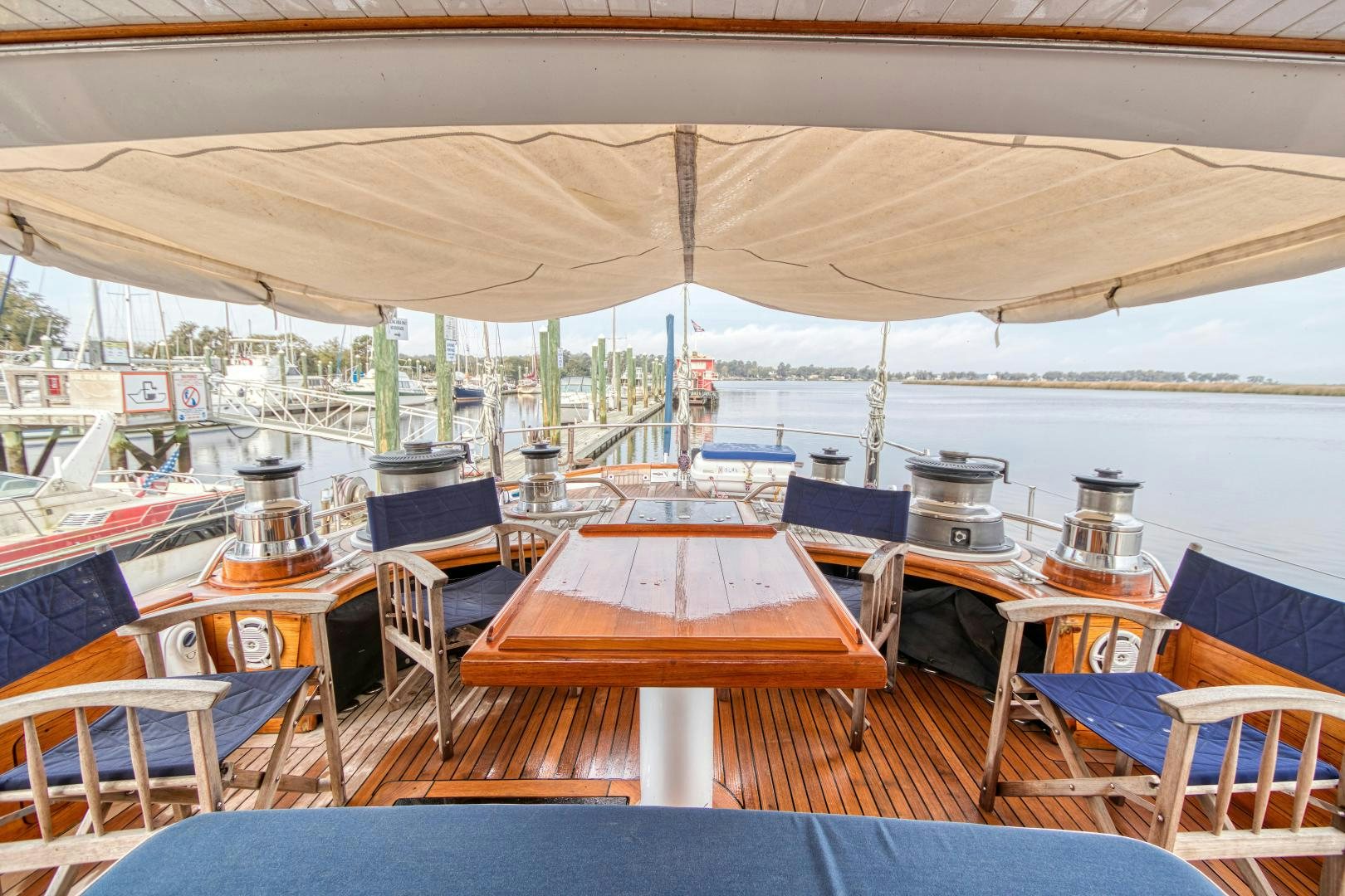 a boat with tables and chairs aboard ARIA Yacht for Sale