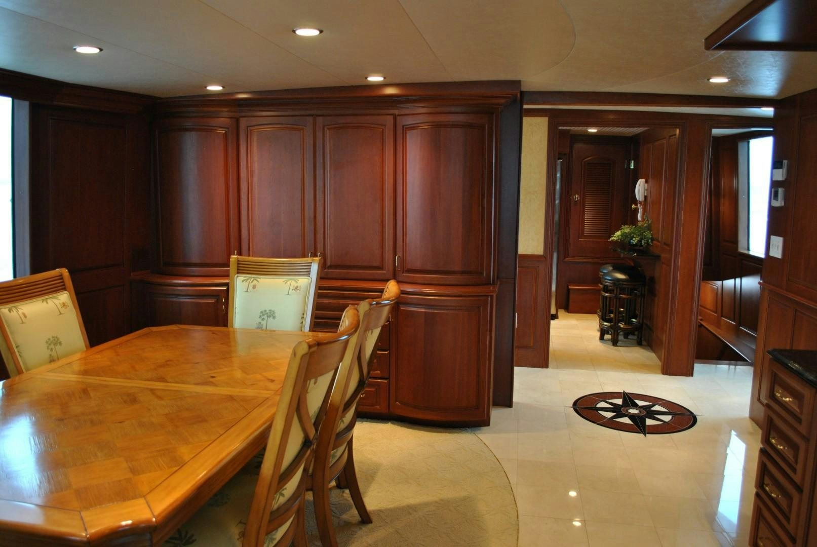 a kitchen with a dining table aboard JENNY LYNNE Yacht for Sale
