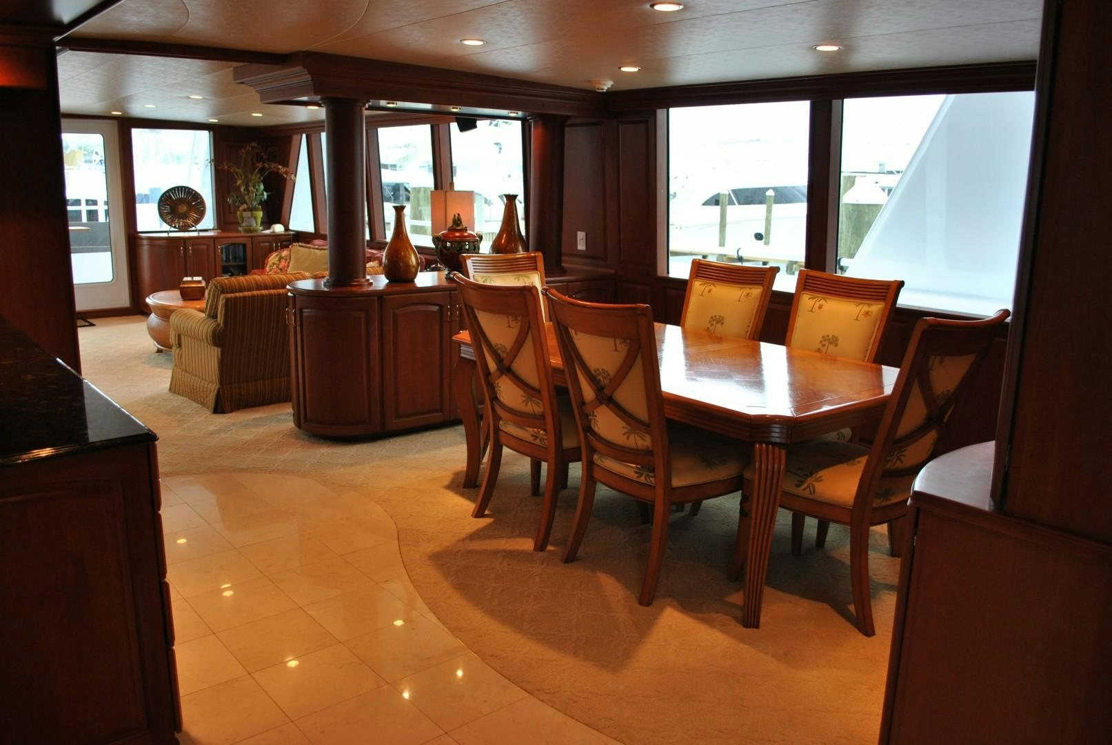a dining room with a table and chairs aboard JENNY LYNNE Yacht for Sale