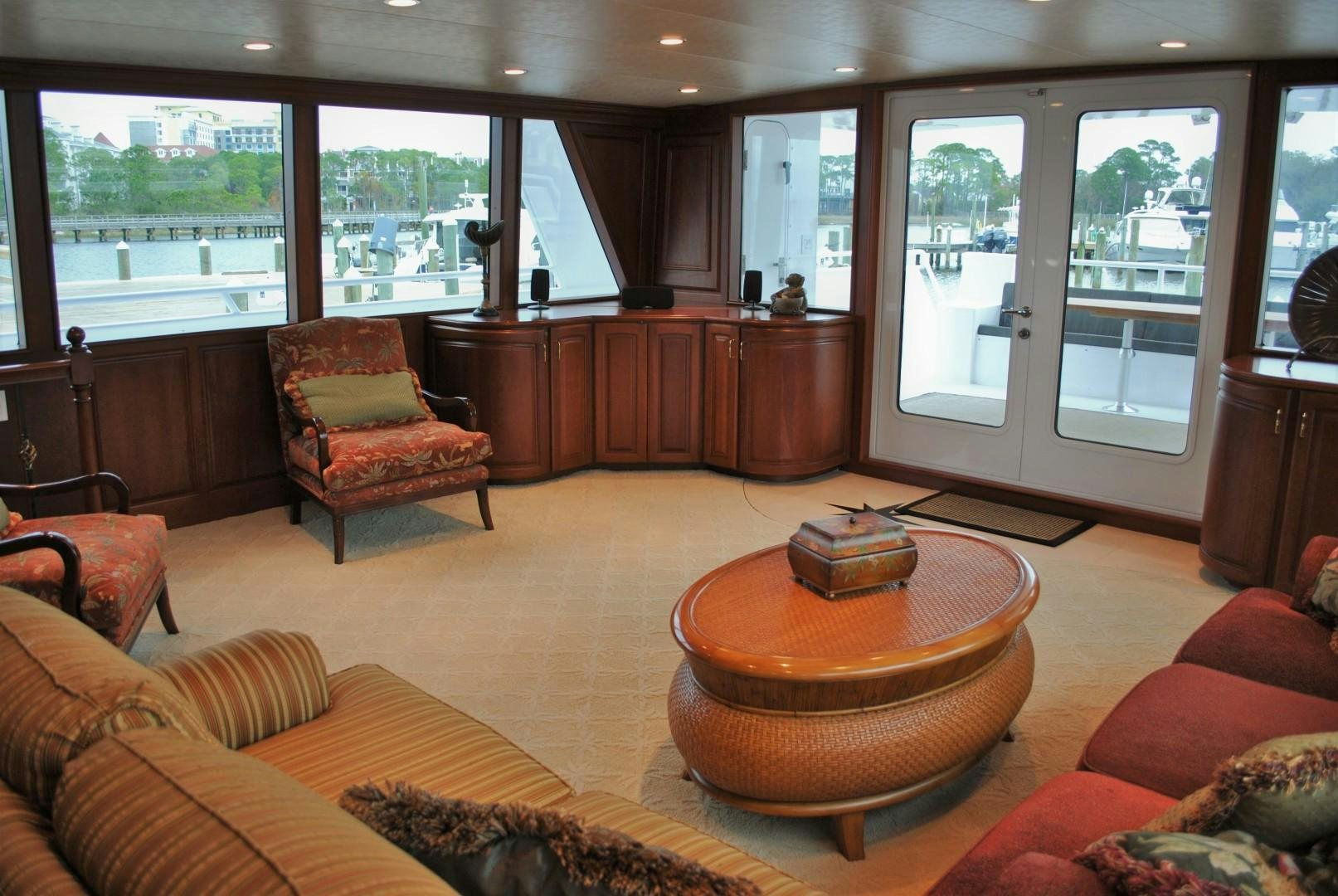 a living room with a large window aboard JENNY LYNNE Yacht for Sale