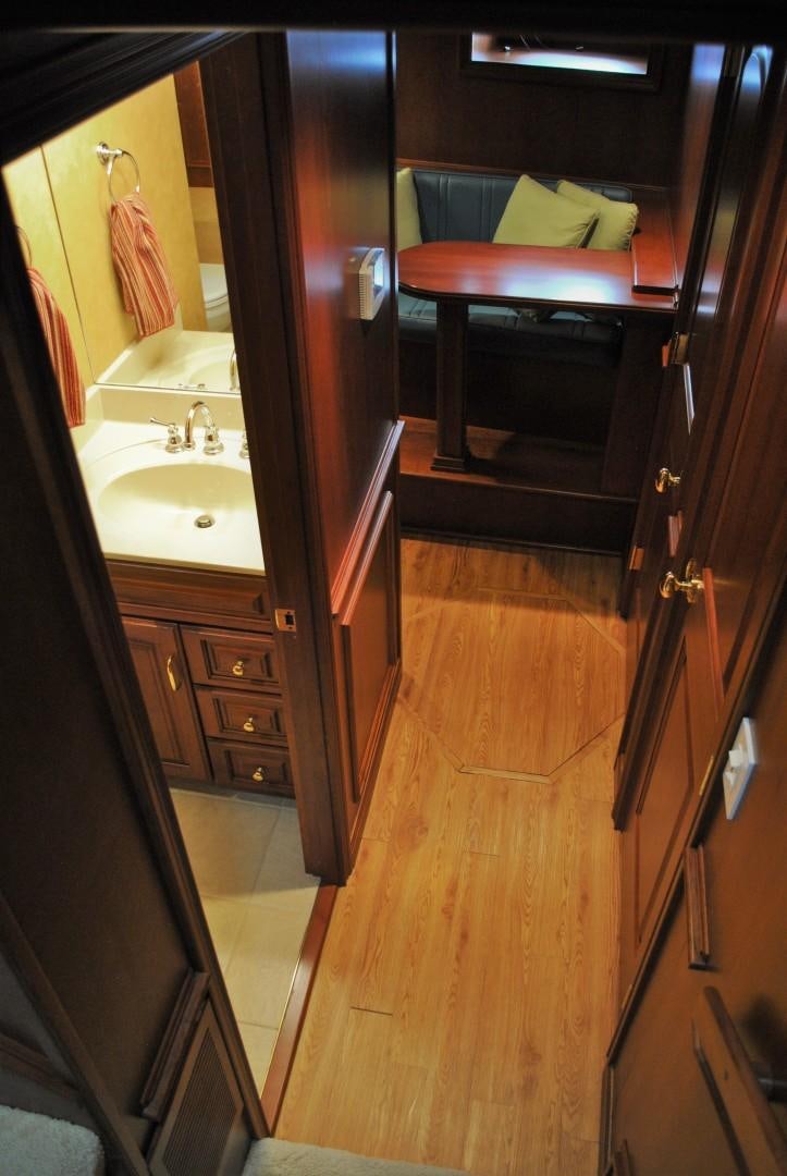 a bathroom with a sink and a mirror aboard JENNY LYNNE Yacht for Sale