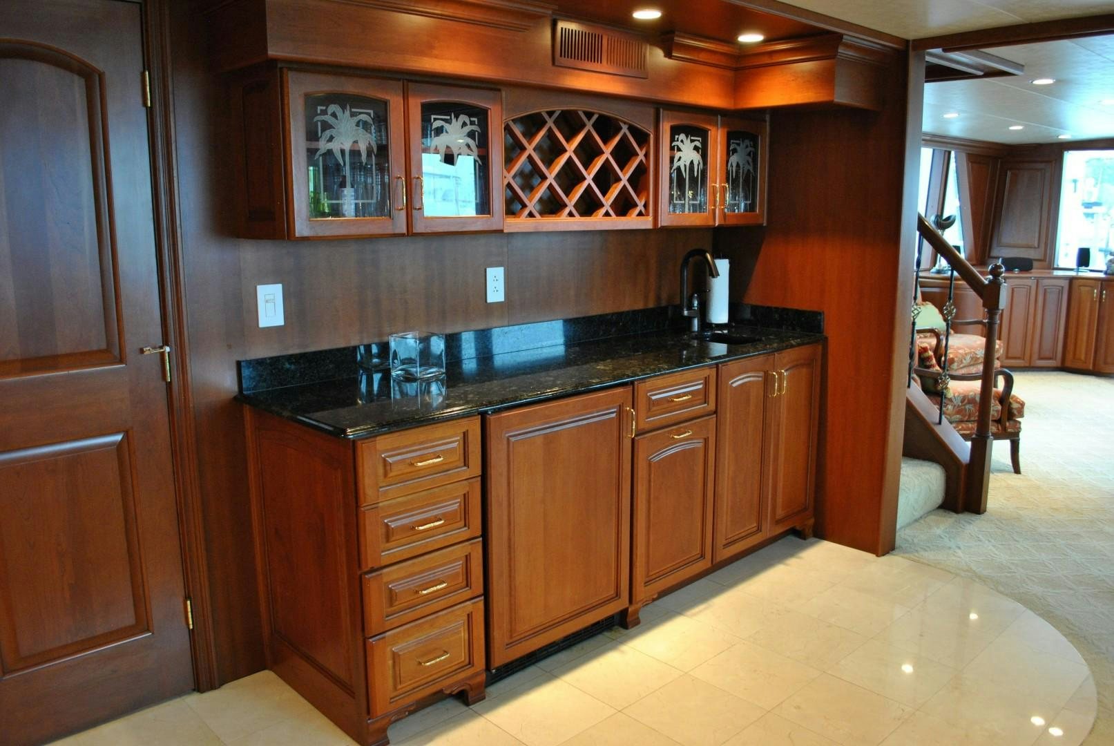 a kitchen with wooden cabinets aboard JENNY LYNNE Yacht for Sale