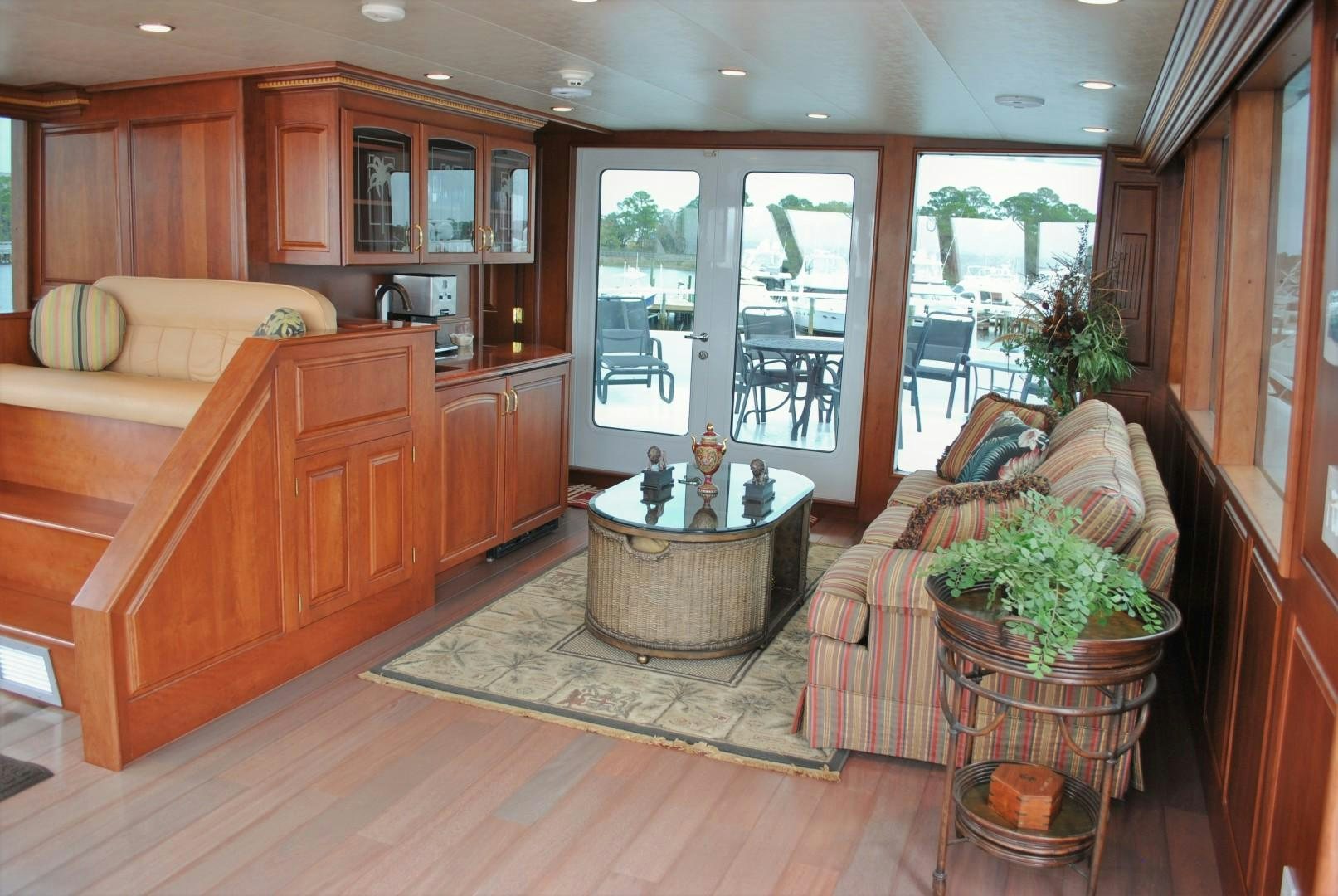 a living room with a table and chairs aboard JENNY LYNNE Yacht for Sale