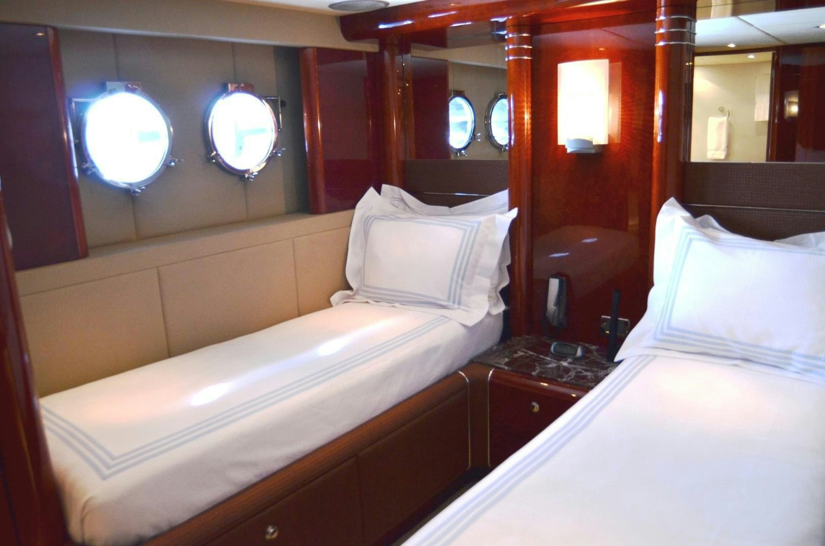 a room with two beds aboard ANDIAMO Yacht for Sale
