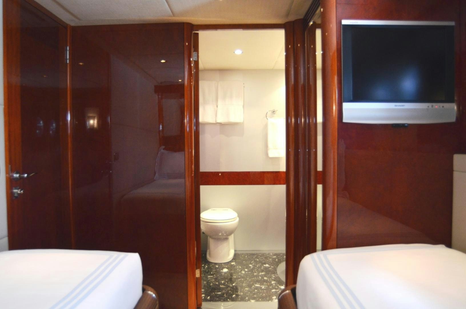 a bathroom with a television and a toilet aboard ANDIAMO Yacht for Sale