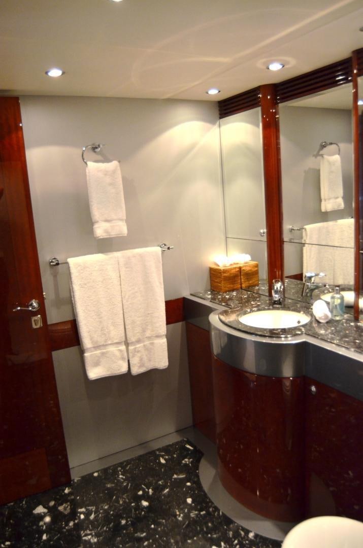 a bathroom with a sink and towels aboard ANDIAMO Yacht for Sale