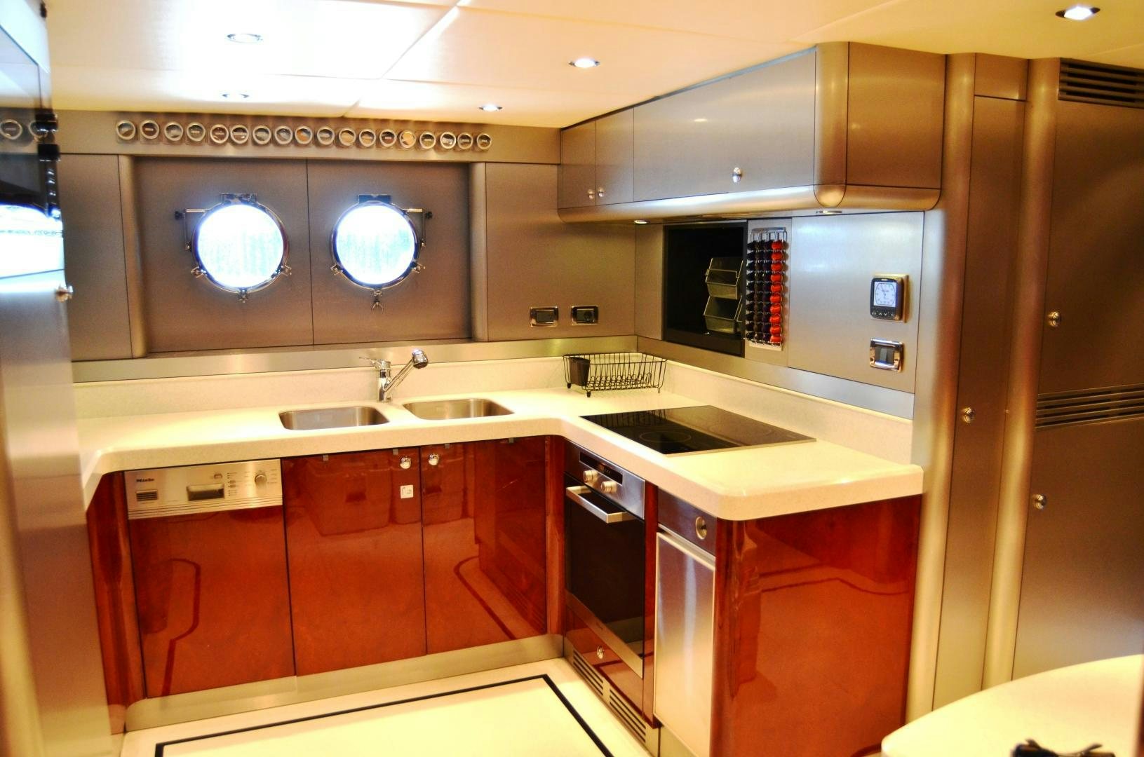 a kitchen with a microwave oven and a sink aboard ANDIAMO Yacht for Sale