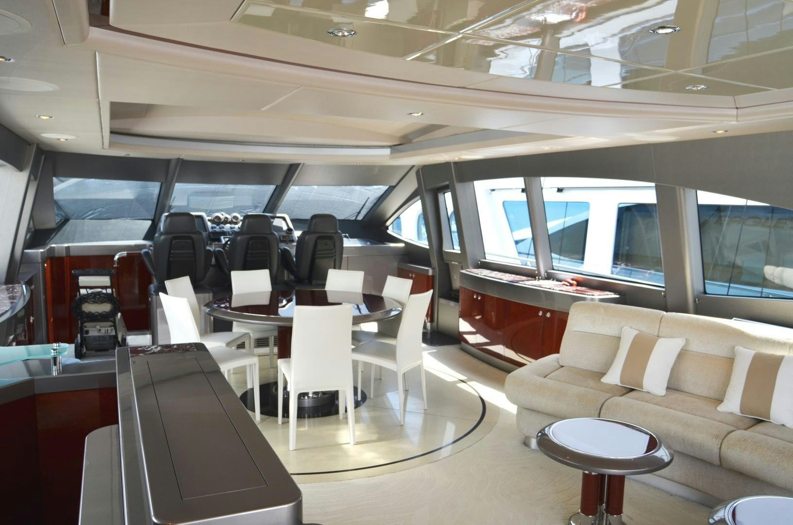 a room with chairs and tables aboard ANDIAMO Yacht for Sale