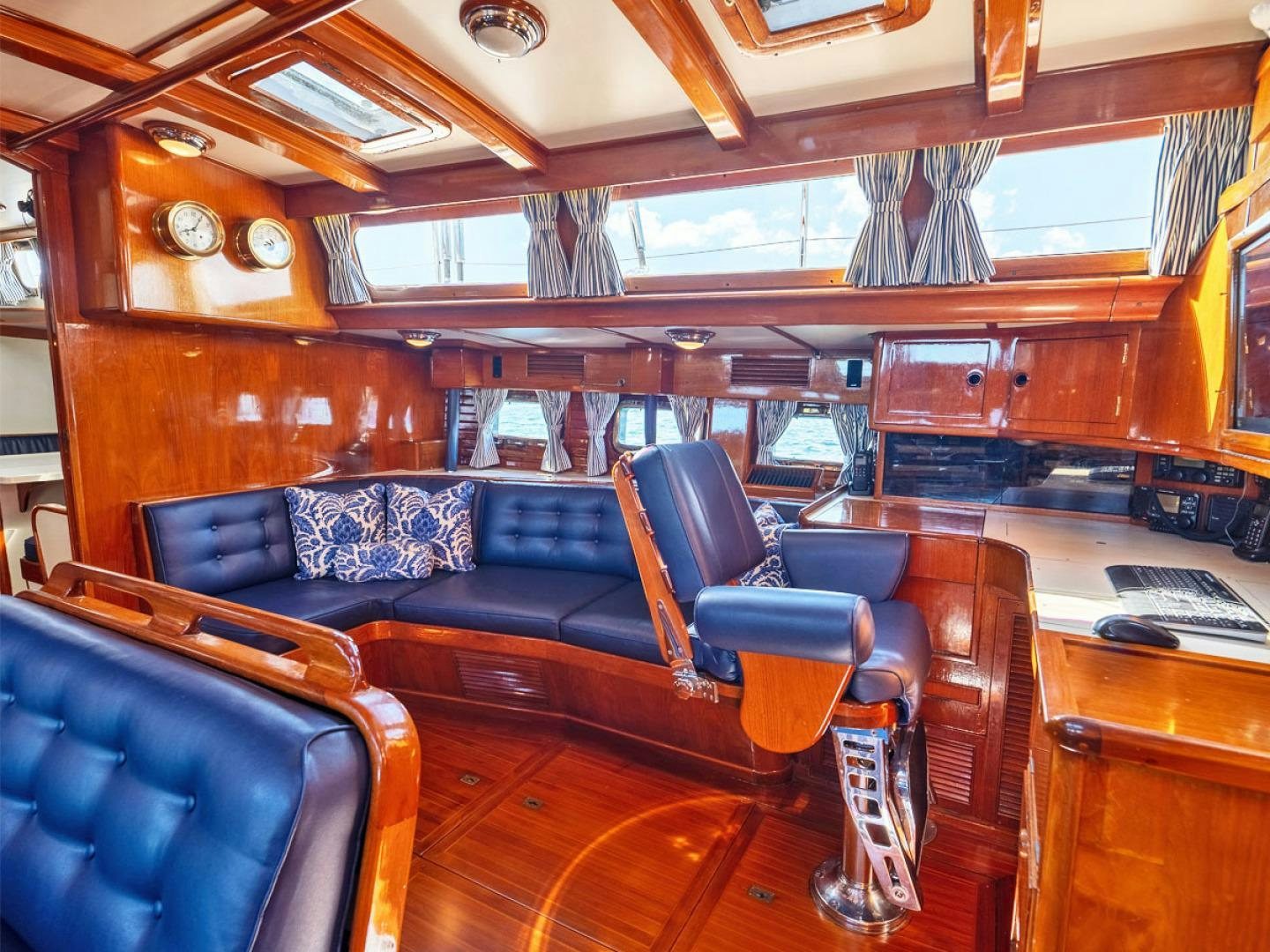 a room with a couch and a desk aboard HERMIE LOUISE Yacht for Sale