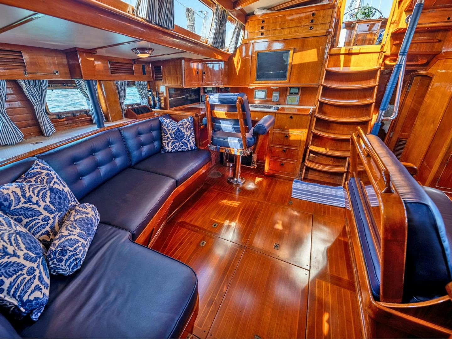 a large cabin with a wood floor aboard HERMIE LOUISE Yacht for Sale