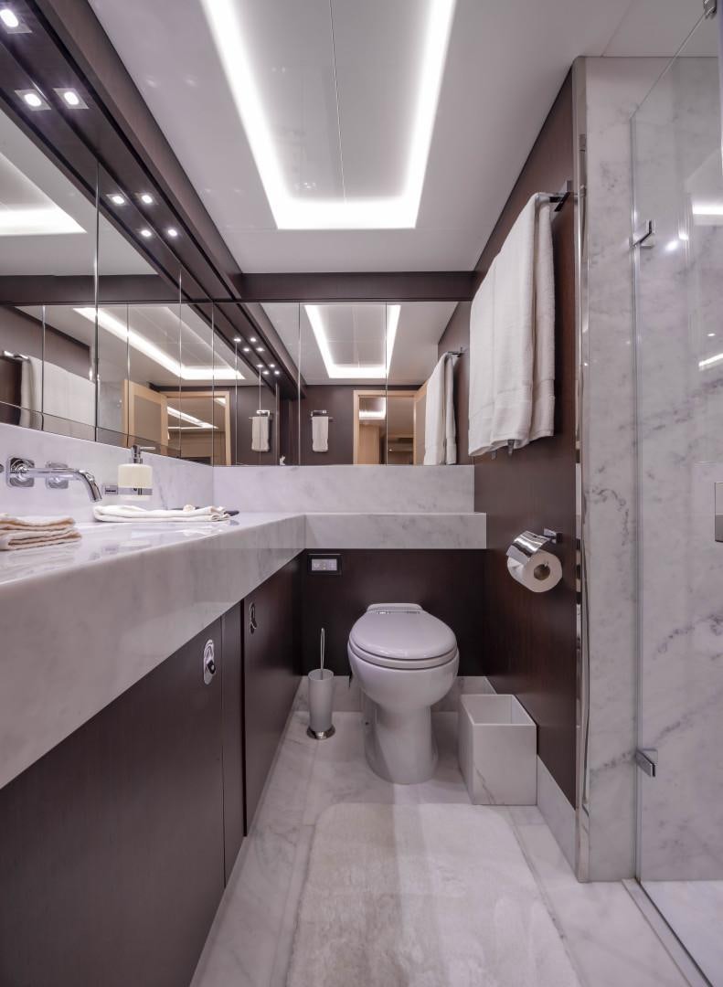 a bathroom with a sink toilet and a shower aboard PURA VIDA Yacht for Sale