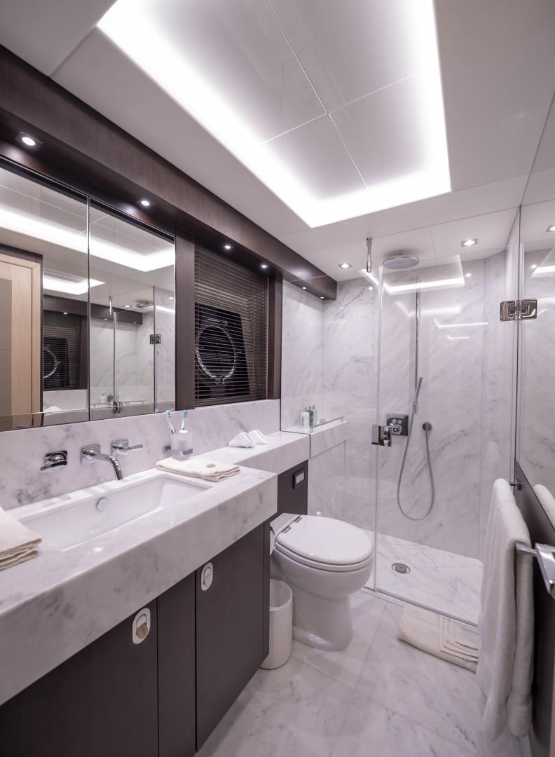 a bathroom with a sink toilet and a shower aboard PURA VIDA Yacht for Sale