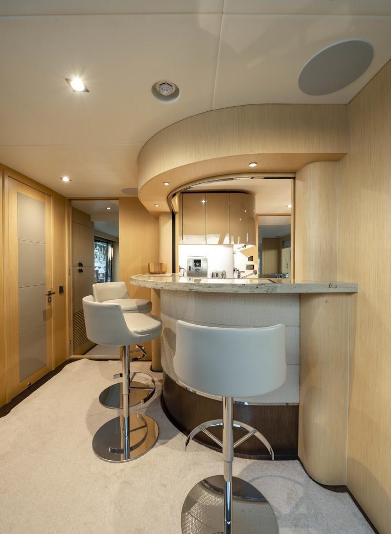 a bathroom with a round mirror aboard PURA VIDA Yacht for Sale