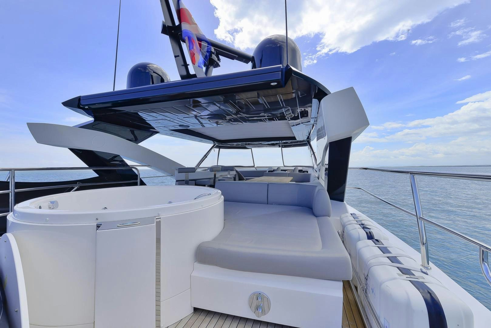 a boat with a blue and white sail aboard PURA VIDA Yacht for Sale
