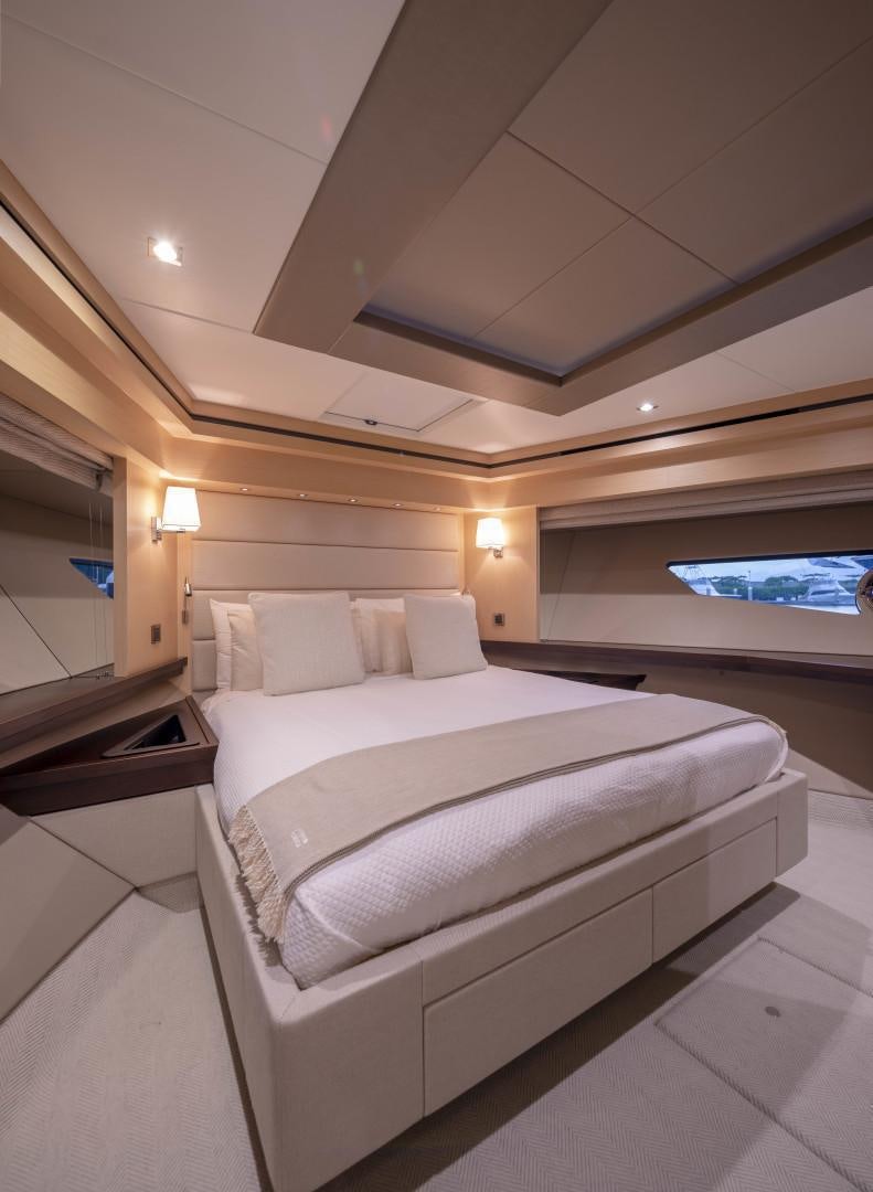 a room with a bed and a window aboard PURA VIDA Yacht for Sale