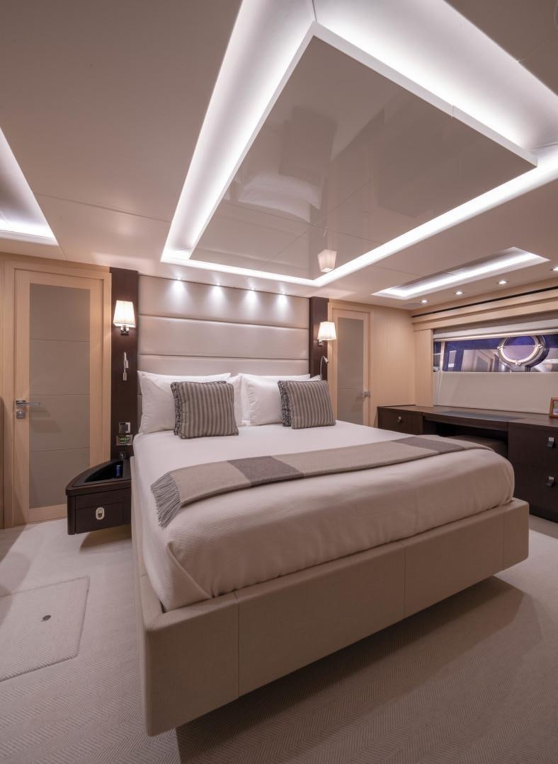 a large bed in a hotel room aboard PURA VIDA Yacht for Sale