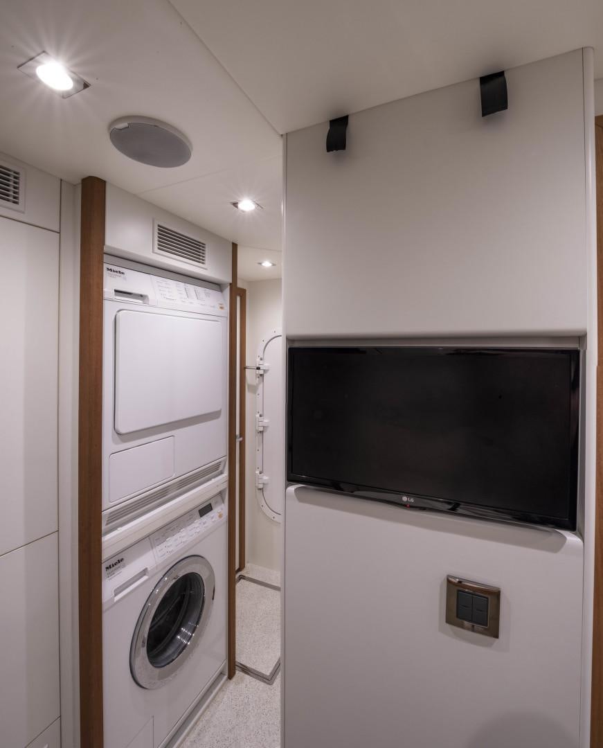 a washer and dryer in a laundry room aboard PURA VIDA Yacht for Sale