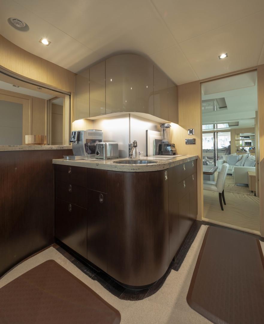 a kitchen with a large island aboard PURA VIDA Yacht for Sale
