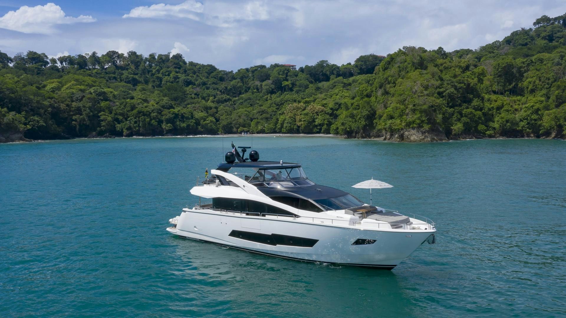 a white boat in the water aboard PURA VIDA Yacht for Sale