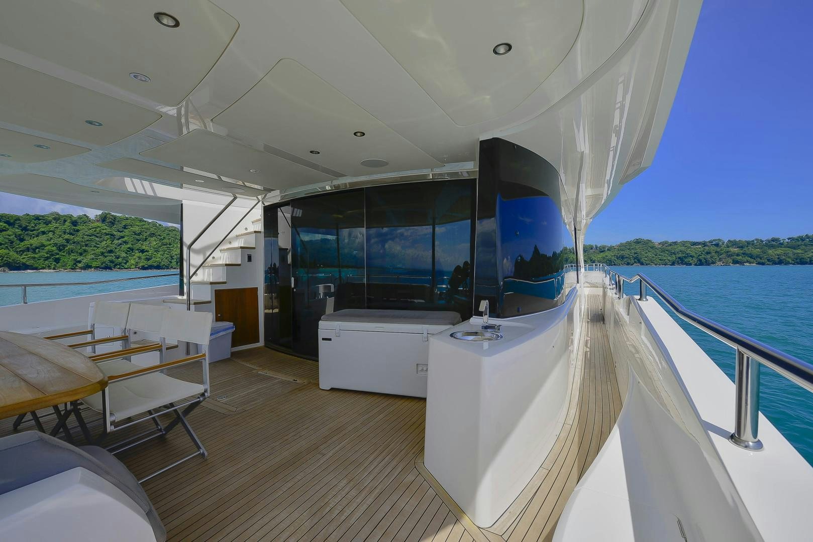 a room with a large window and a view of the water aboard PURA VIDA Yacht for Sale