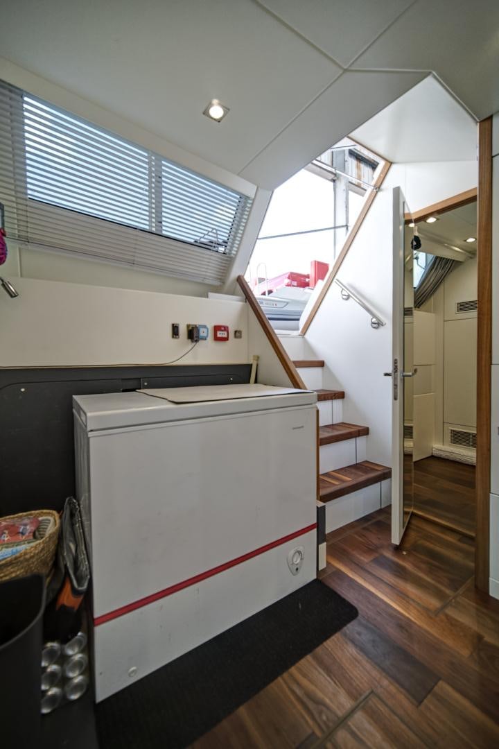 a large white rectangular object in a room with wood floors aboard 'S NOON SOMEWHERE Yacht for Sale