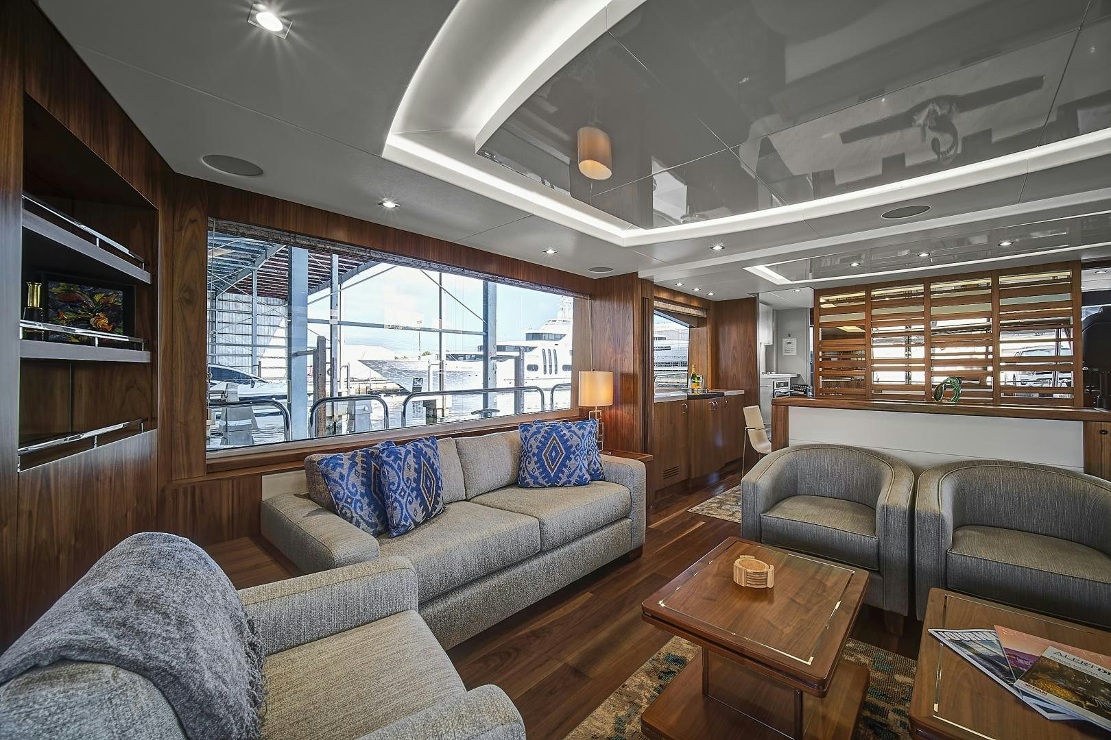 a living room with a large window aboard 'S NOON SOMEWHERE Yacht for Sale