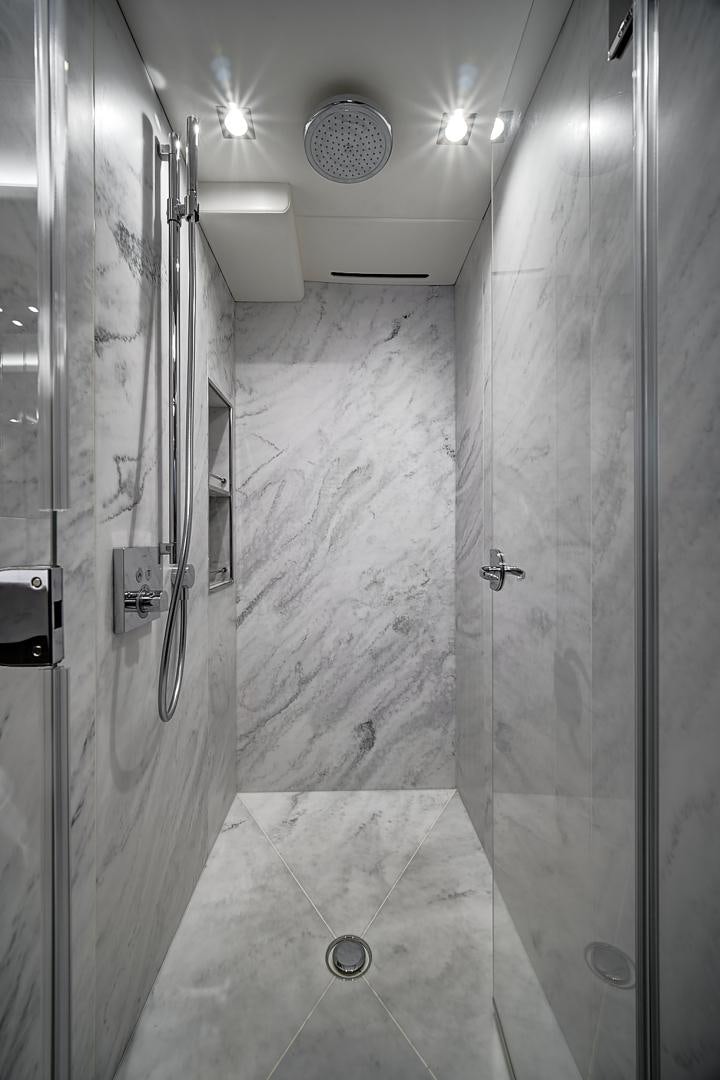 a bathroom with a shower unit and sink aboard 'S NOON SOMEWHERE Yacht for Sale