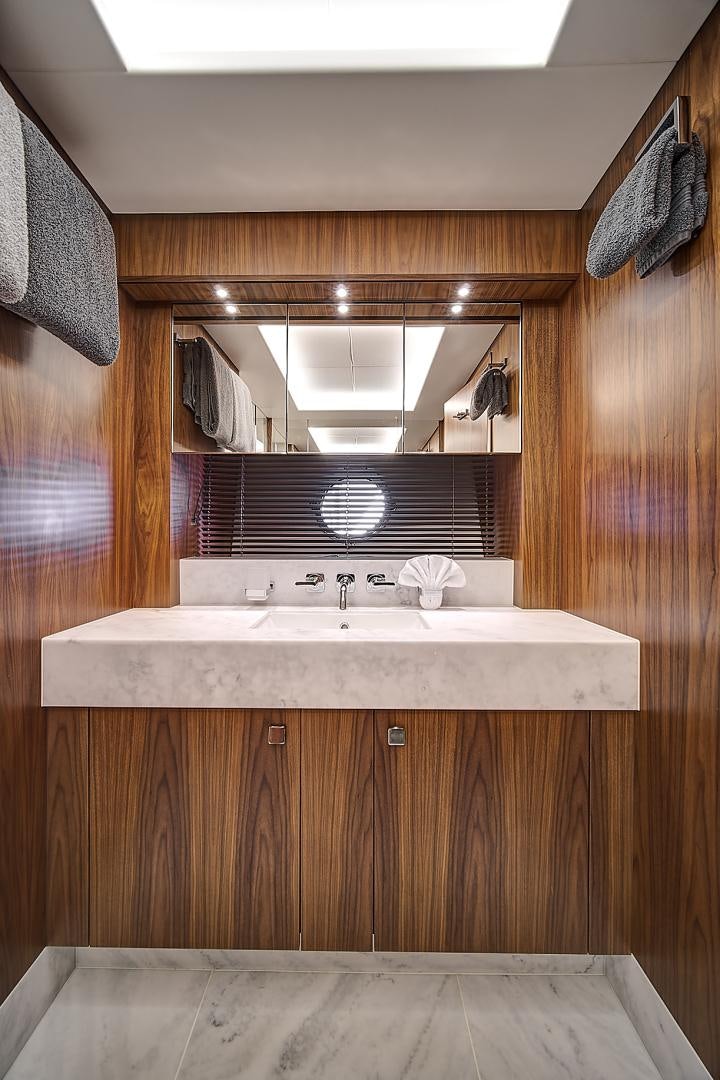 a bathroom with a sink and a mirror aboard 'S NOON SOMEWHERE Yacht for Sale