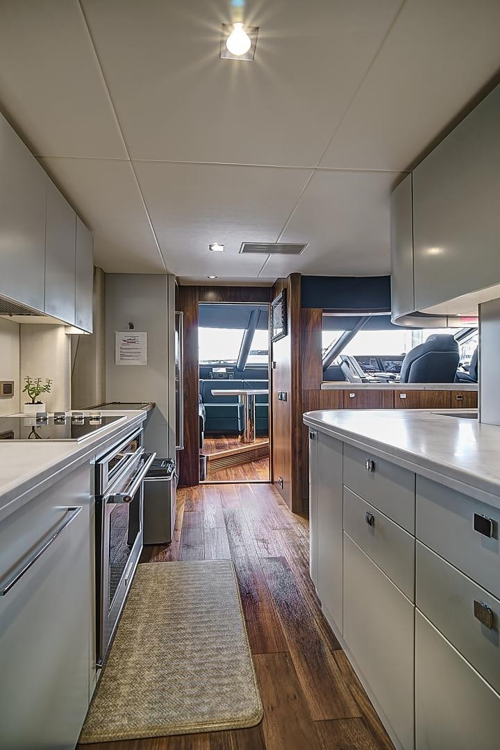 a kitchen with a large island aboard 'S NOON SOMEWHERE Yacht for Sale