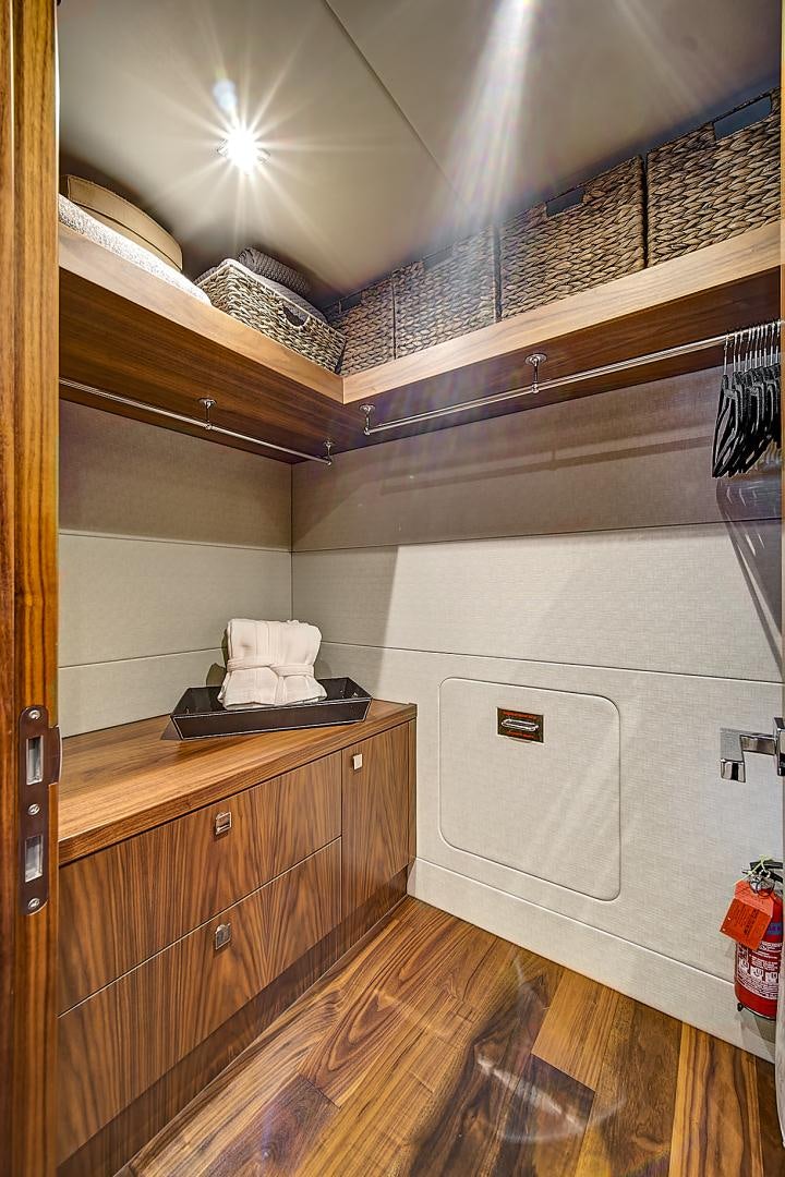 a room with a wood floor and a large white fan aboard 'S NOON SOMEWHERE Yacht for Sale