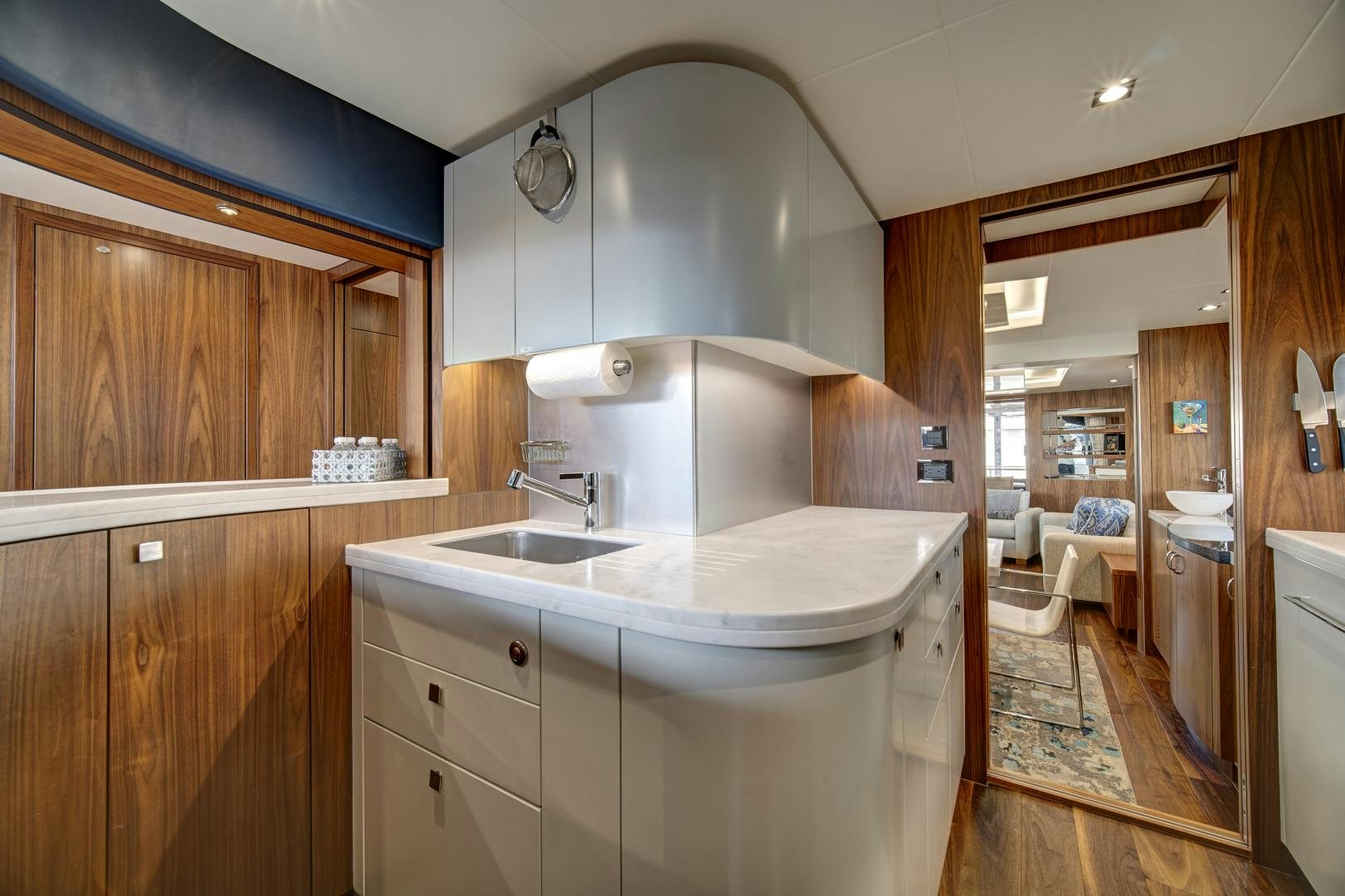 a kitchen with a sink and cabinets aboard 'S NOON SOMEWHERE Yacht for Sale