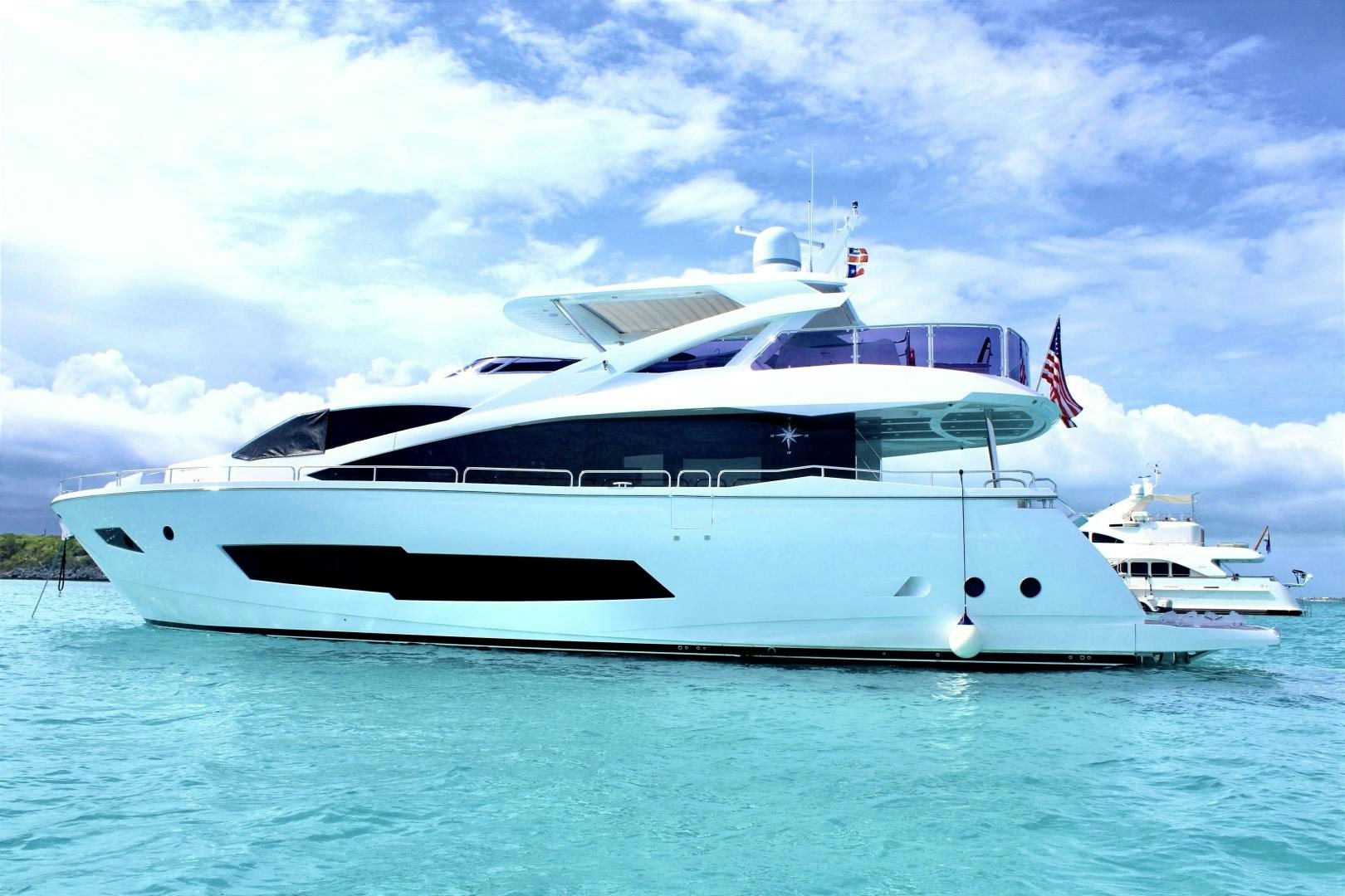 a white yacht in the water aboard IT'S NOON SOMEWHERE Yacht for Sale