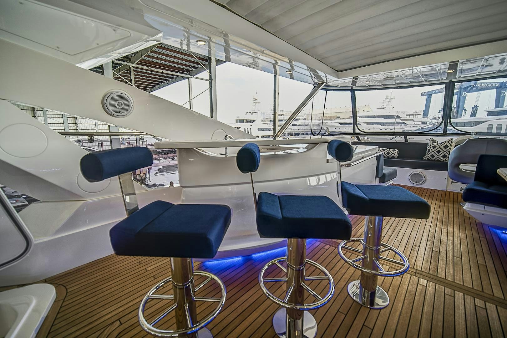 a plane with seats and a table aboard 'S NOON SOMEWHERE Yacht for Sale