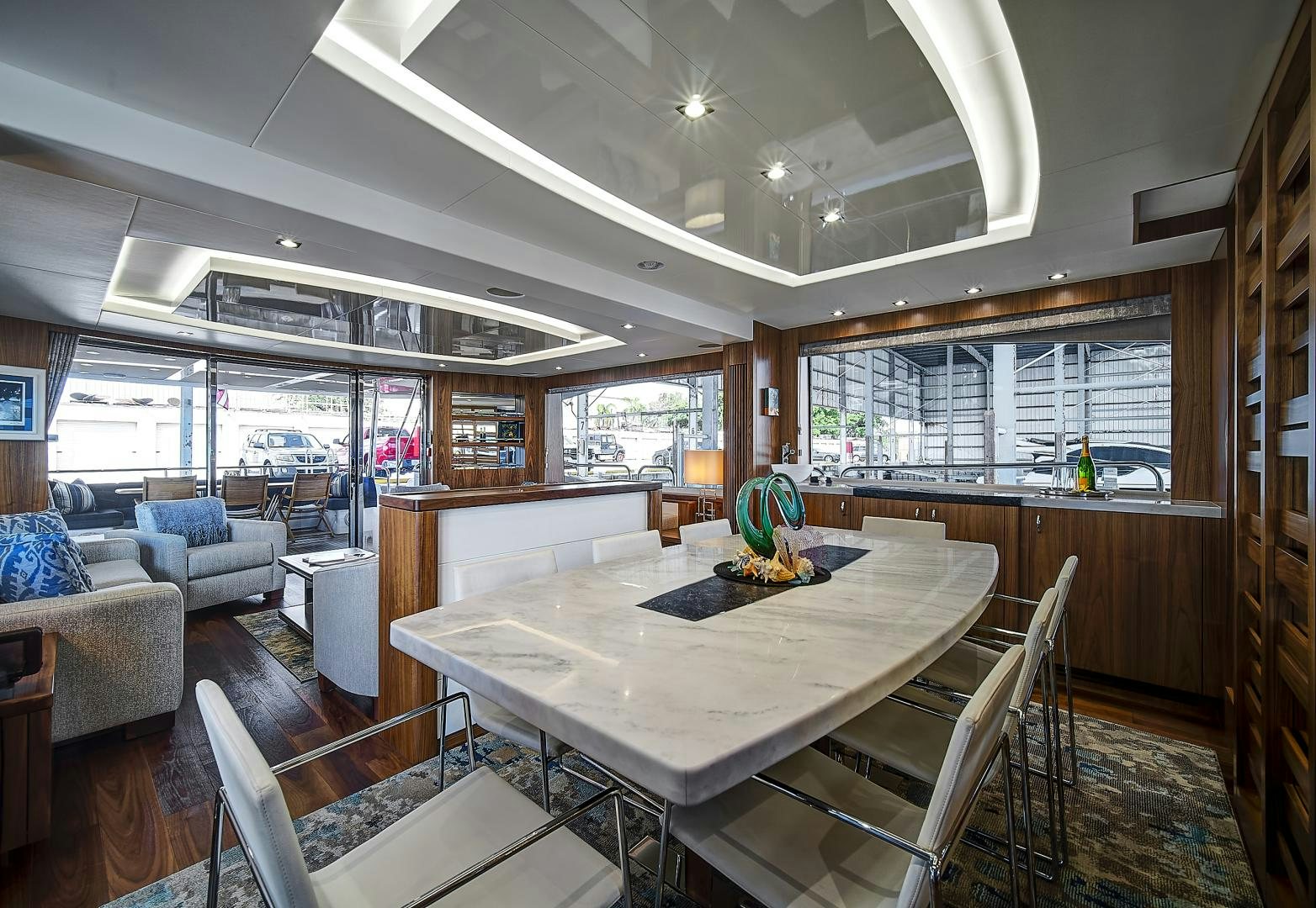 a large kitchen with a table aboard 'S NOON SOMEWHERE Yacht for Sale