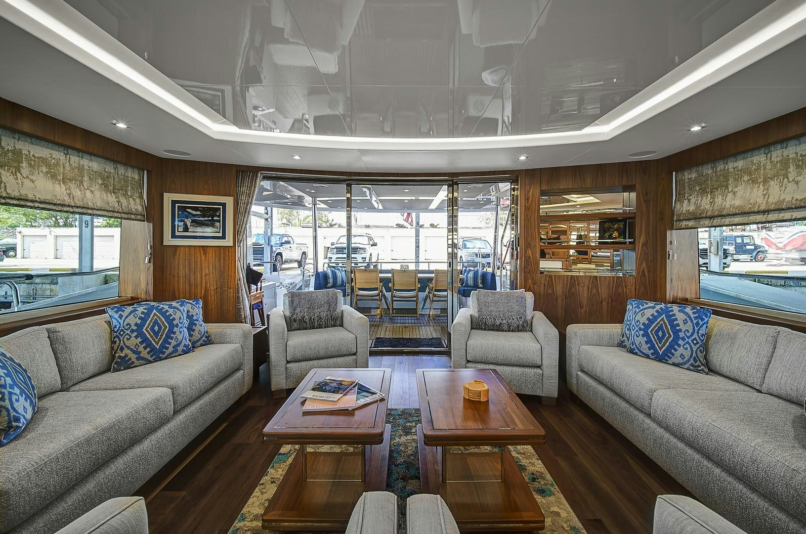 a living room with a large window aboard 'S NOON SOMEWHERE Yacht for Sale
