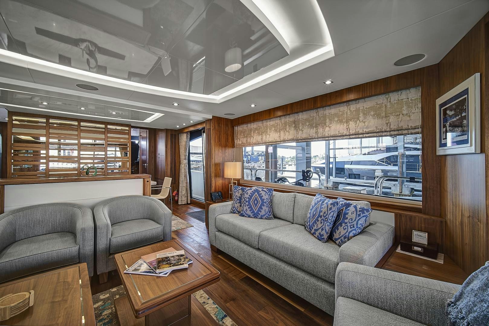 a living room with a large window aboard 'S NOON SOMEWHERE Yacht for Sale