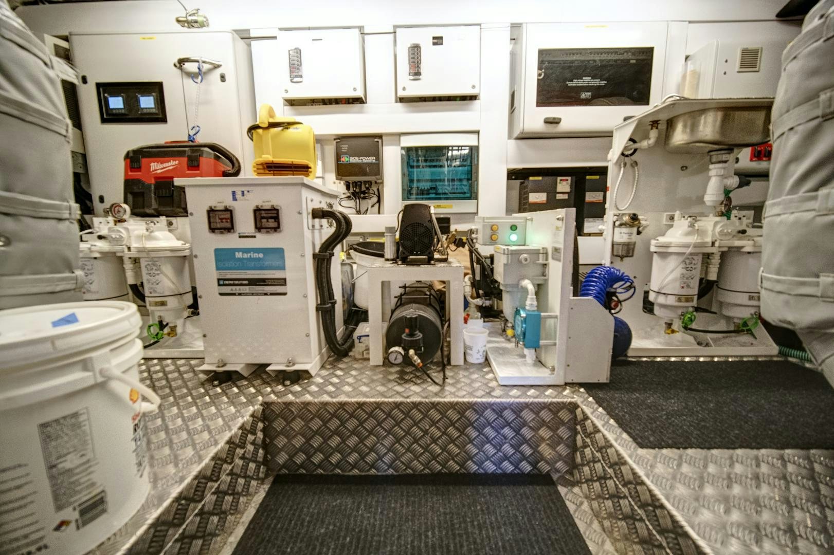 a few people working in a factory aboard 'S NOON SOMEWHERE Yacht for Sale