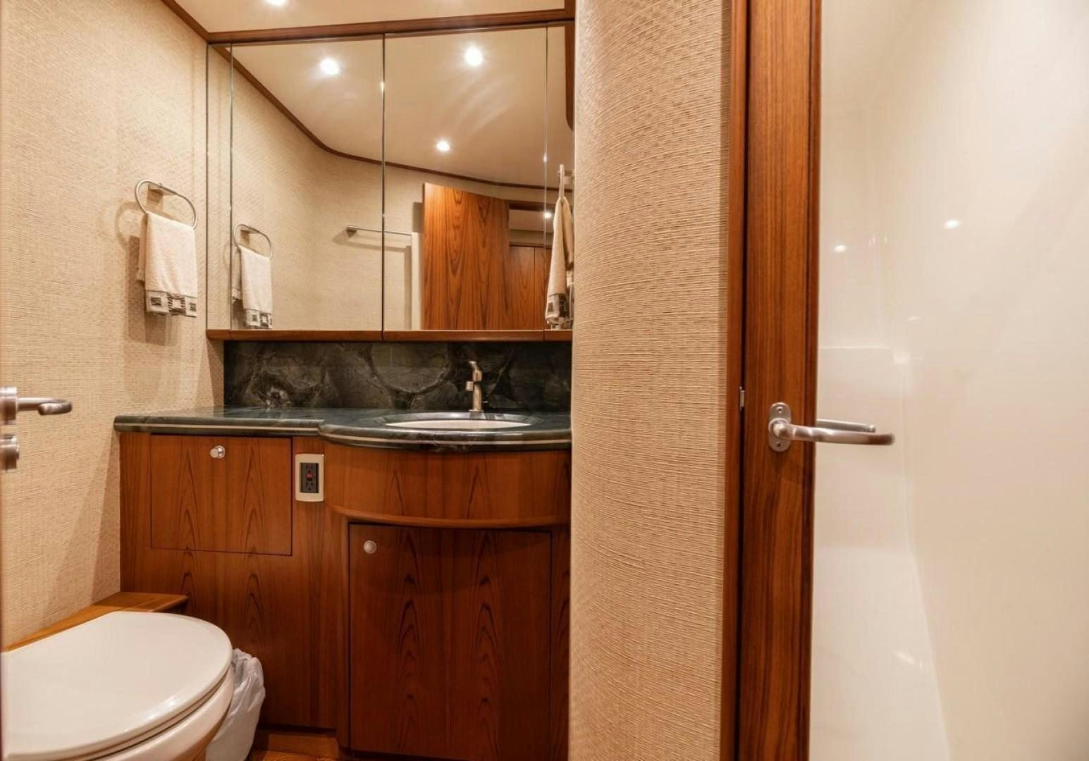 a bathroom with a sink and toilet aboard DESTINY Yacht for Sale
