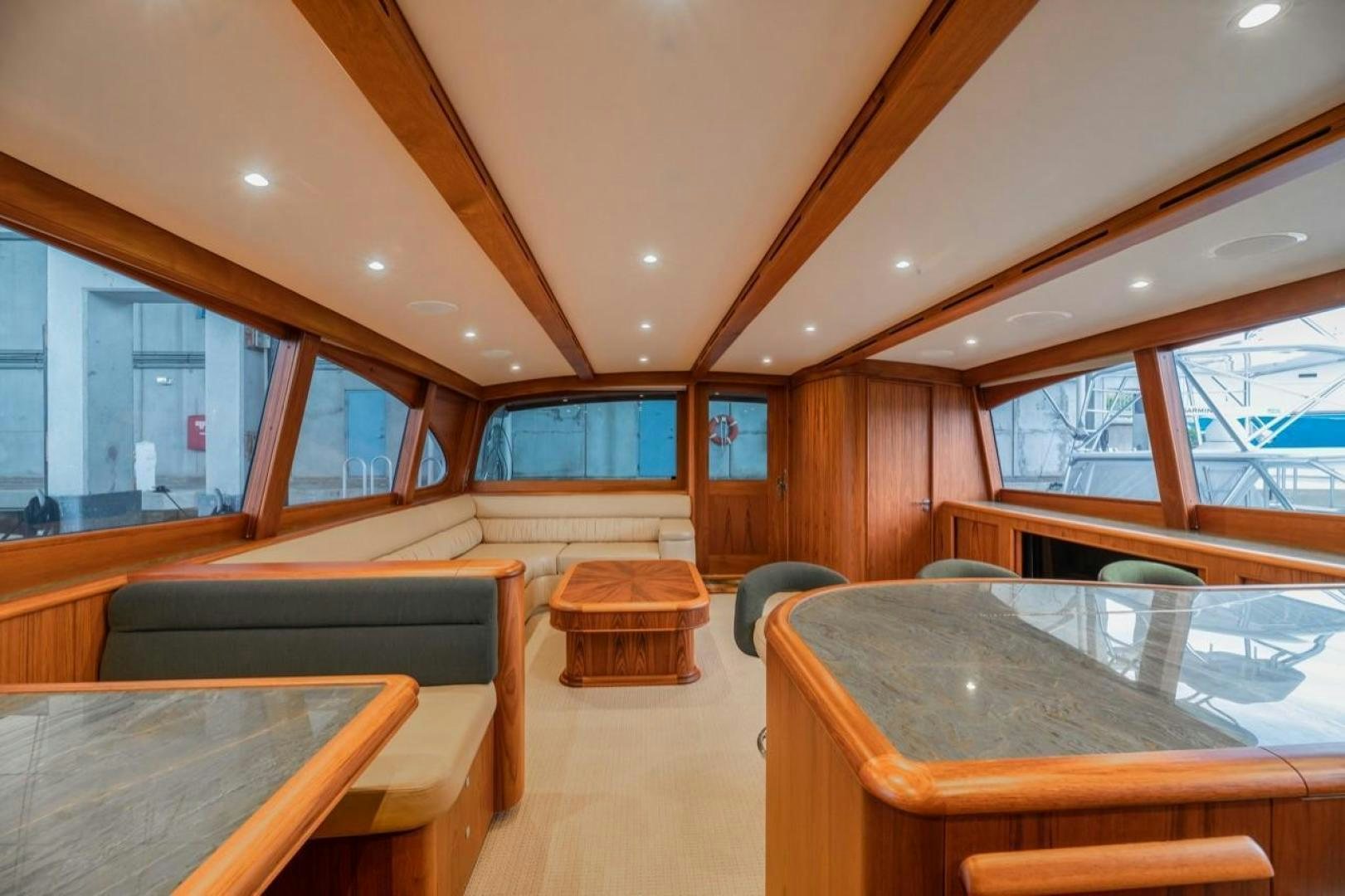 a room with a table and chairs aboard DESTINY Yacht for Sale