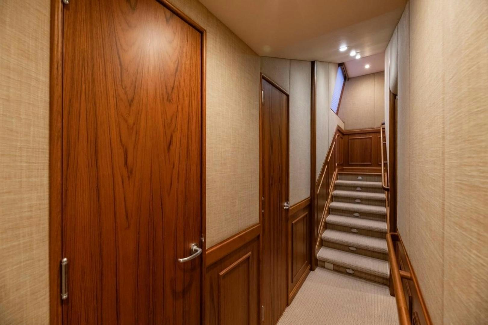 a hallway with wooden doors aboard DESTINY Yacht for Sale