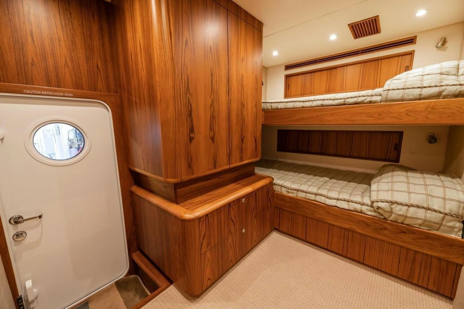 a room with a bed and a washing machine aboard DESTINY Yacht for Sale