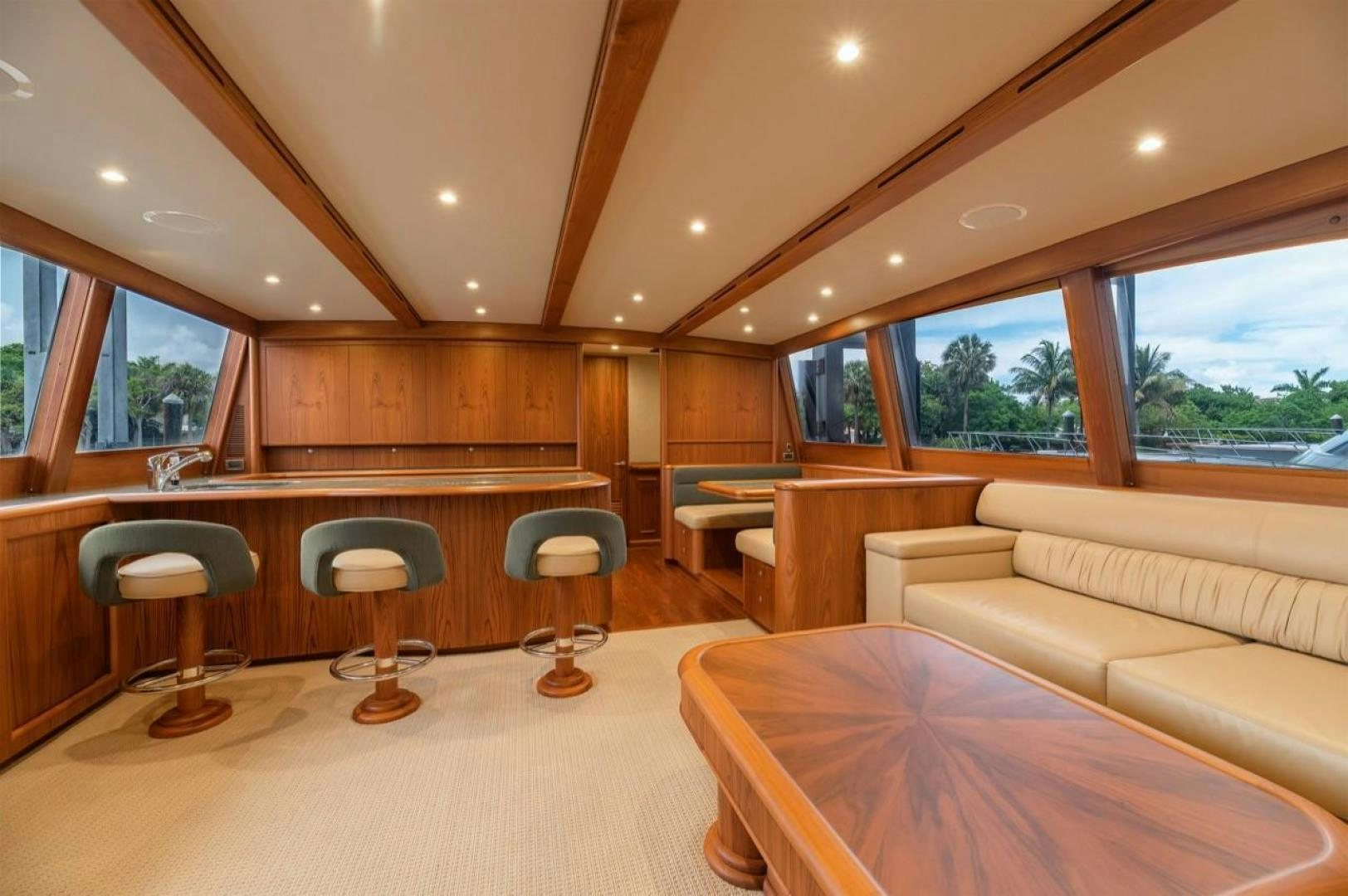 a room with a couch and a table and chairs aboard DESTINY Yacht for Sale