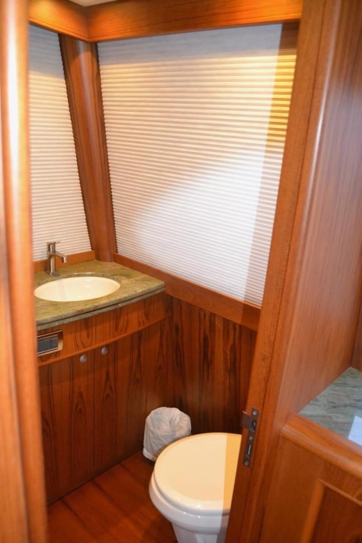 a bathroom with a toilet and a sink aboard DESTINY Yacht for Sale