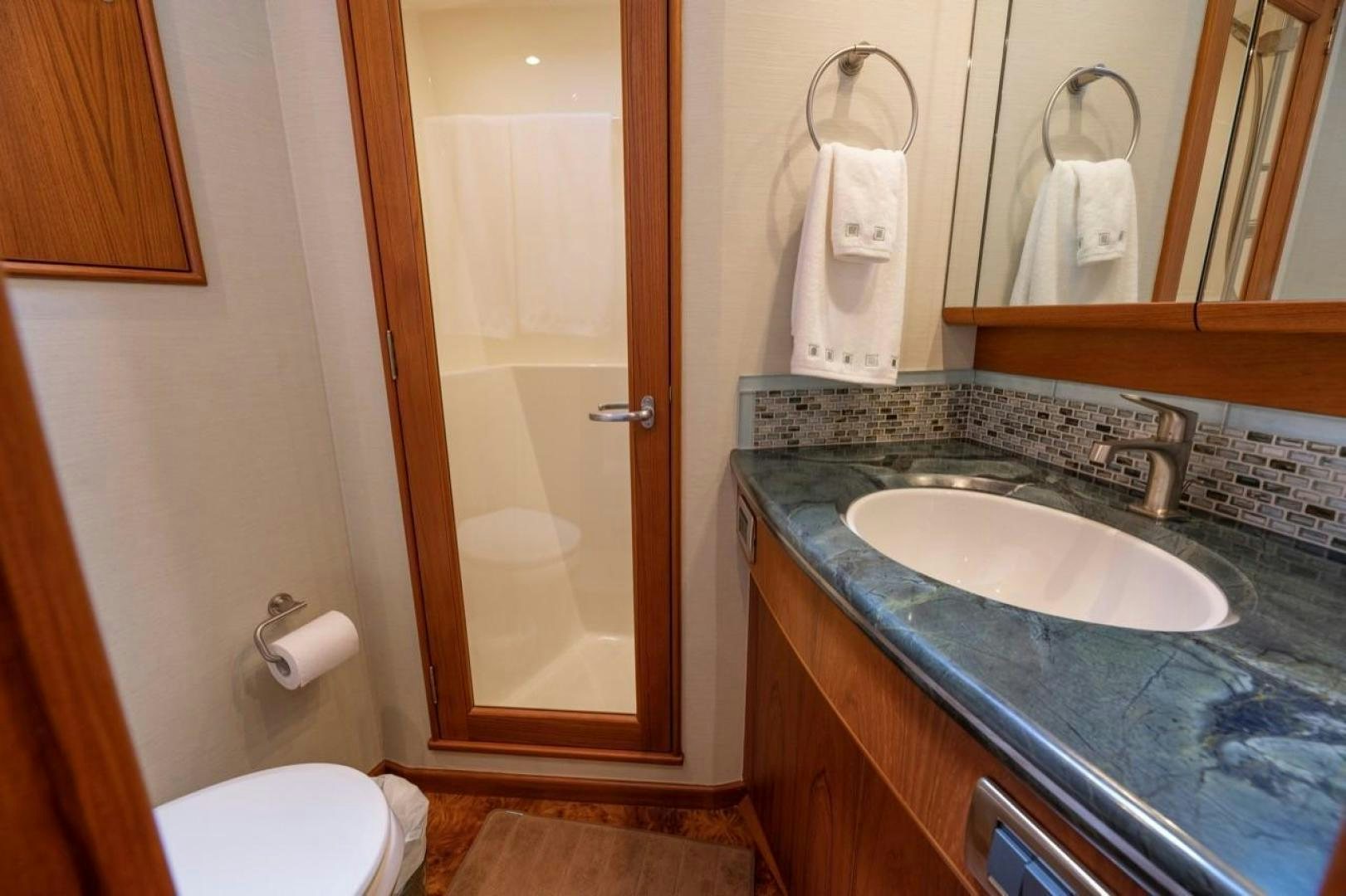 a bathroom with a sink and a toilet aboard DESTINY Yacht for Sale