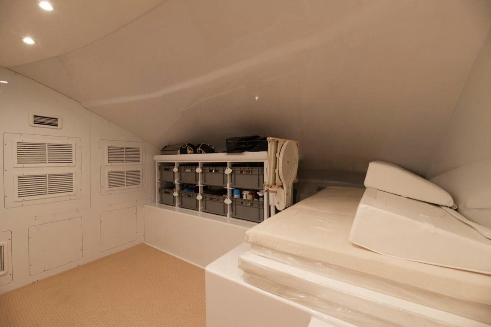 a room with a bed and a machine aboard DESTINY Yacht for Sale