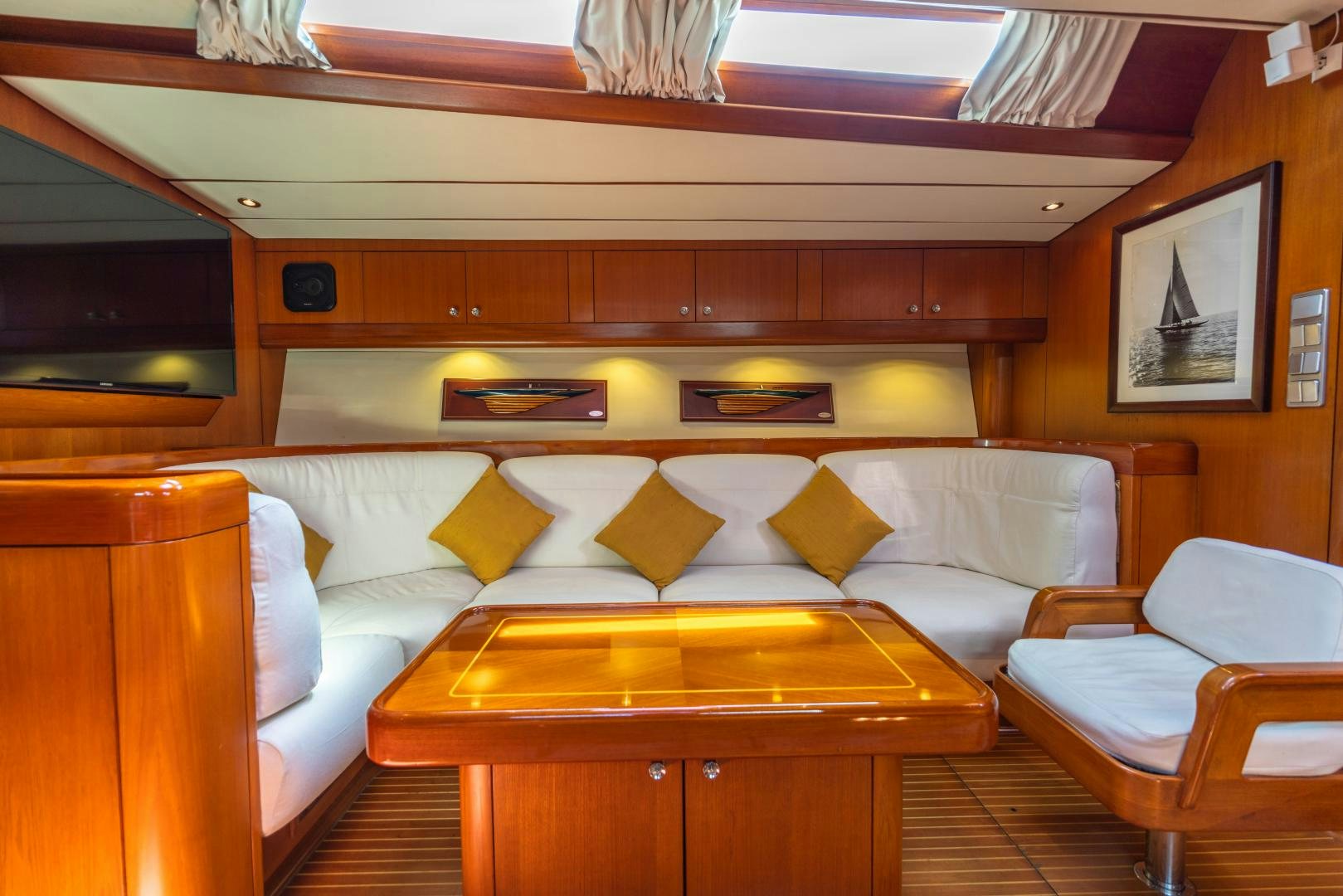 a room with a couch and a table aboard ASPIRATION Yacht for Sale