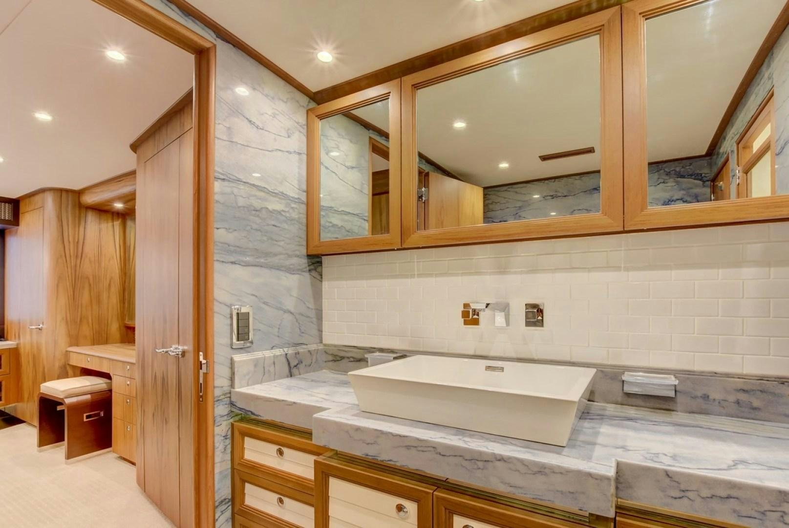 a bathroom with a large jacuzzi tub aboard III AMIGOS Yacht for Sale
