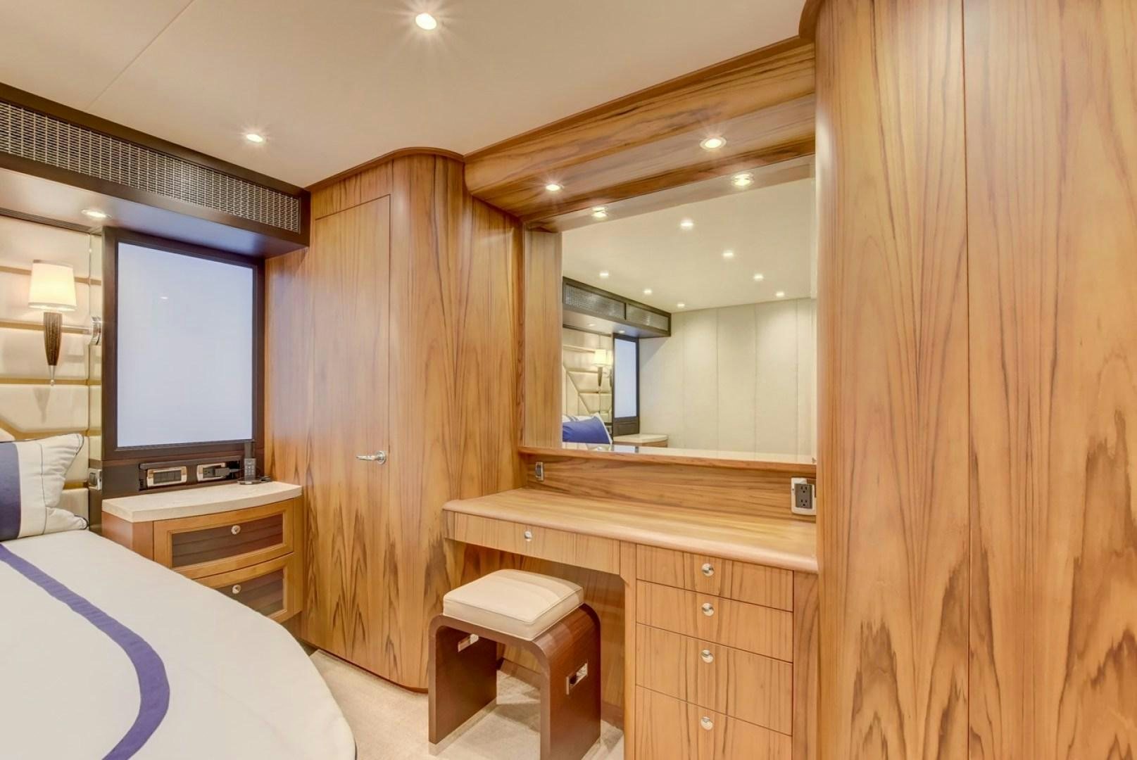 a room with a wood wall and a television on the wall aboard III AMIGOS Yacht for Sale